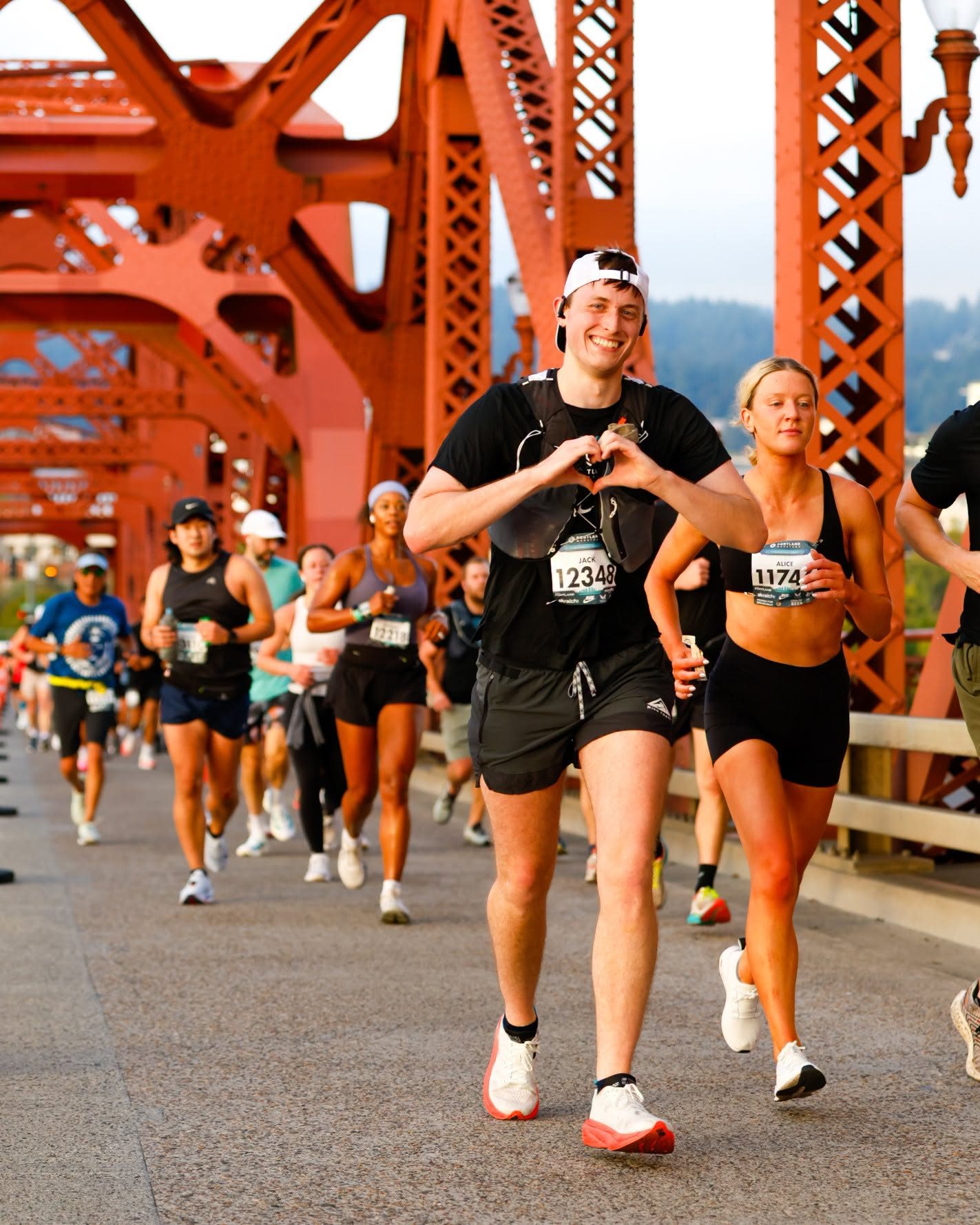 Runners crossing Portland's red bridge during race weekend