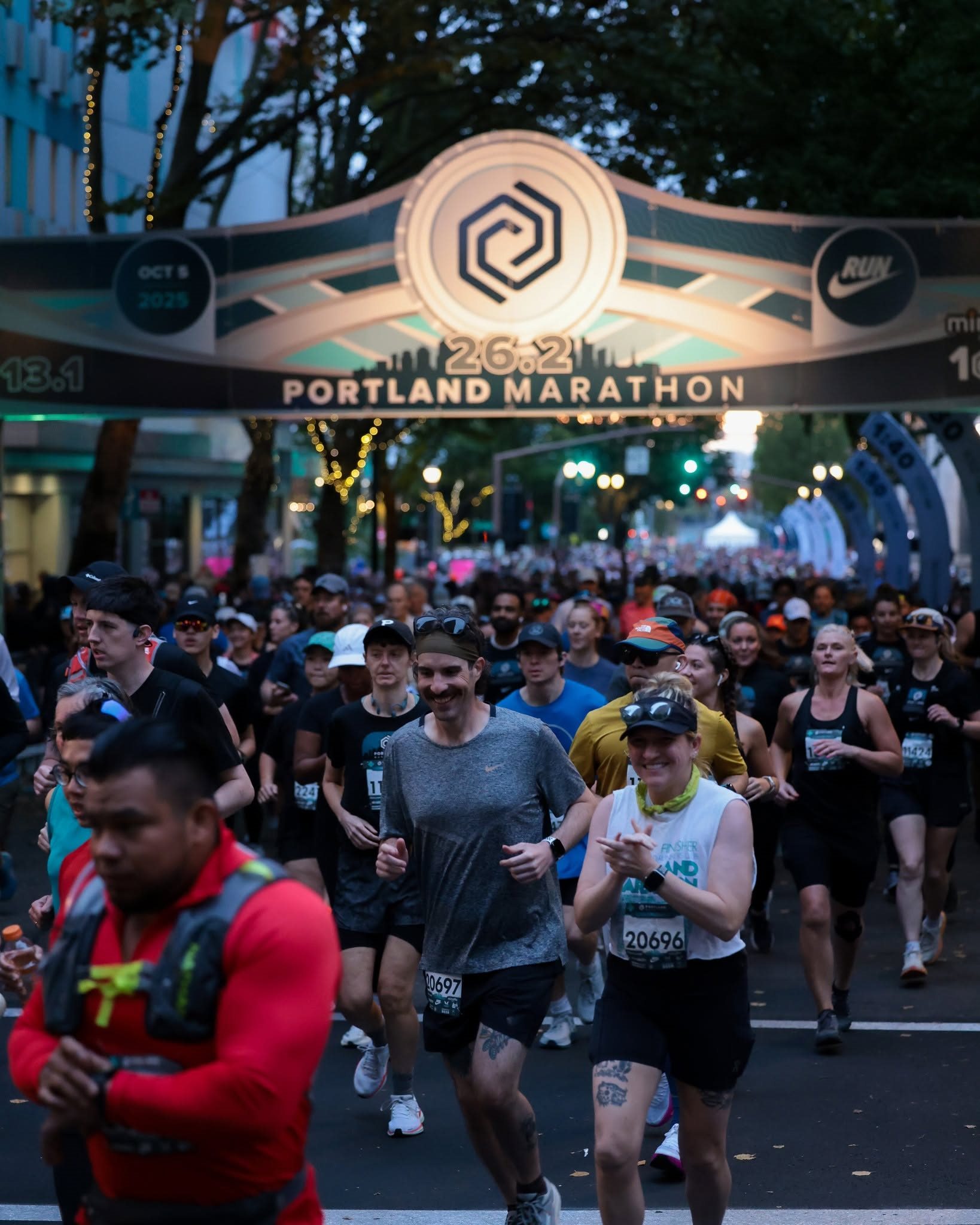Runners passing beneath the Portland Marathon arch